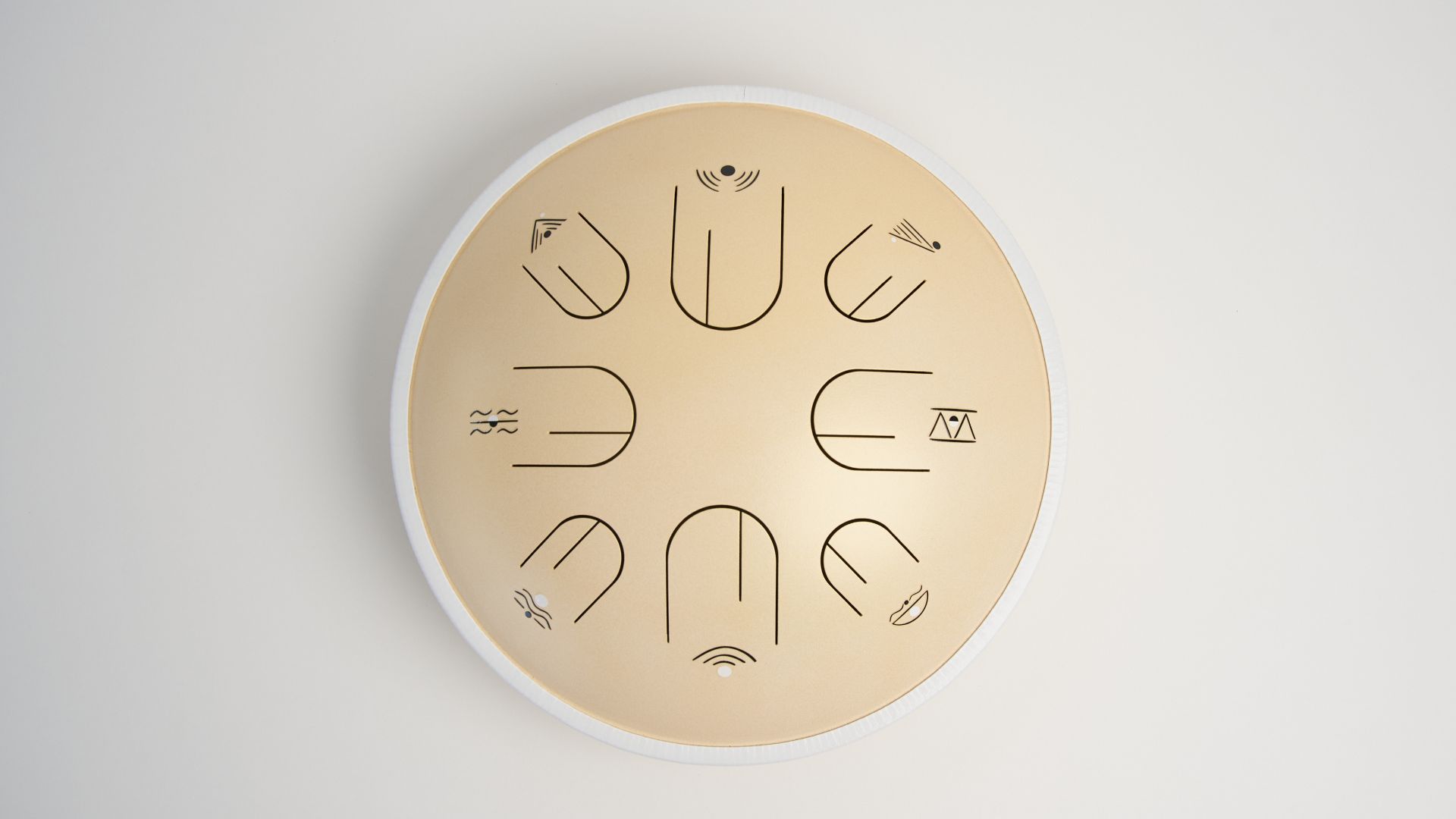Moon Tone 12.5-inch steel tongue drum in Warm Sky Cream, top view showing eight tongues
