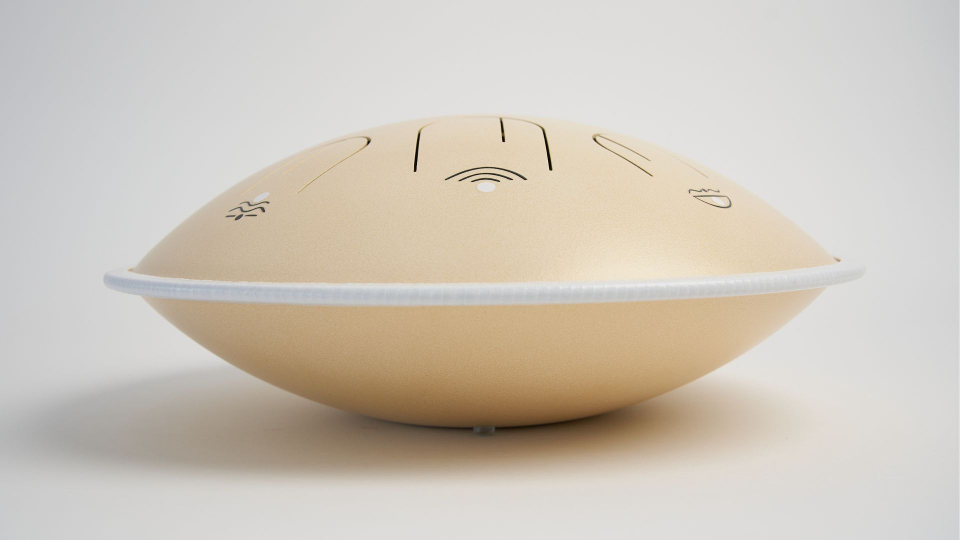 Moon Tone steel tongue drum in Warm Sky Cream, angled to show its rounded body